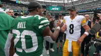 Former New York Jets teammates Breece Hall and Aaron Rodgers, who was playing for the Pittsburgh Steelers.