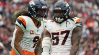 Denver Broncos safety Talanoa Hufanga (9) and Denver Broncos linebacker Dre Greenlaw (57) celebrate after a play during the first half against the Houston Texans at NRG Stadium.