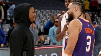 Memphis Grizzlies guard Ja Morant (left) talks with Phoenix Suns forward Dillon Brooks (3) after the game at FedExForum.
