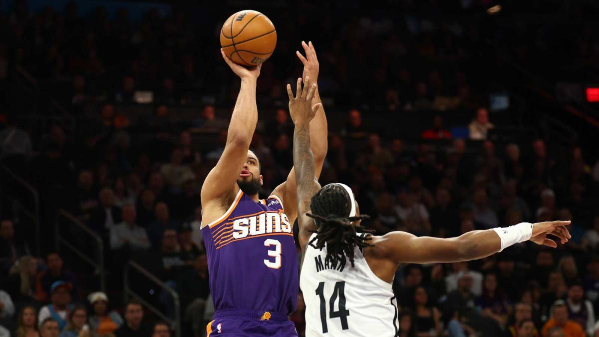Phoenix Suns forward Dillon Brooks (3) shoots the ball against Brooklyn Nets guard Terance Mann (14) in the first half at Mortgage Matchup Center.