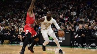 Boston Celtics guard Jaylen Brown (7) controls the ball while Chicago Bulls guard Coby White (0) defends during the first half at TD Garden.