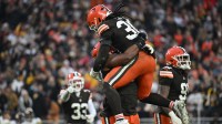 Cleveland Browns defensive tackle Shelby Harris (93) and linebacker Devin Bush (30) celebrate in the fourth quarter against the Pittsburgh Steelers at Huntington Bank Field.