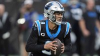 Carolina Panthers quarterback Bryce Young (9) drops back to pass against the Los Angeles Rams in the first half during the NFC Wild Card Round game at Bank of America Stadium.