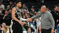 Bucks forward Giannis Antetokounmpo (34) exits the game in the fourth quarter as head coach Doc Rivers shakes his hand during game four against the Indiana Pacers of first round for the 2024 NBA Playoffs at Fiserv Forum