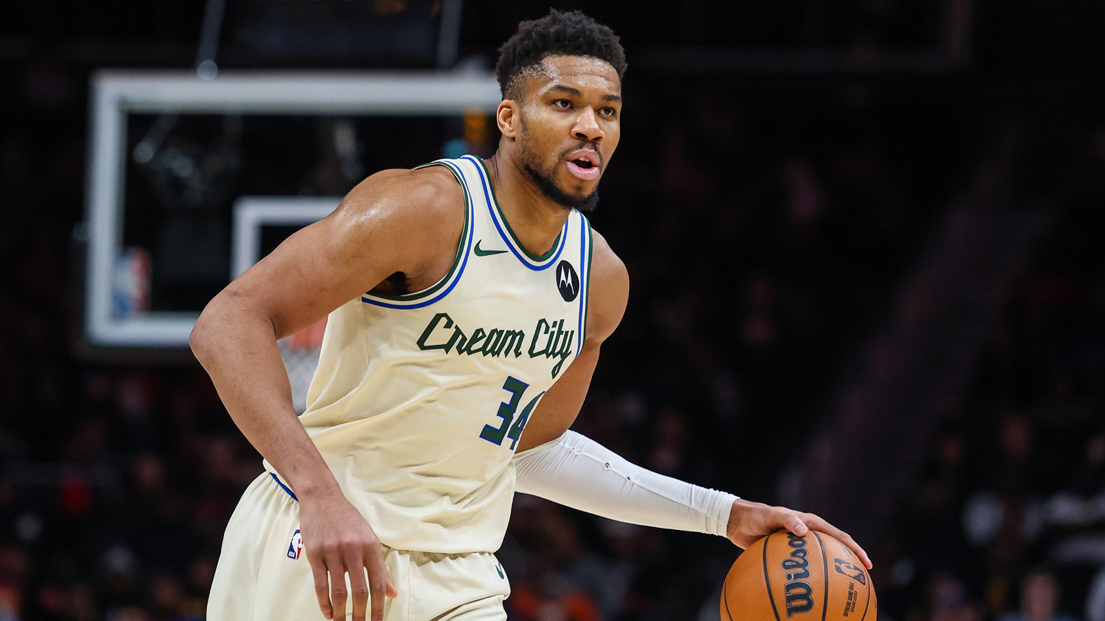 Bucks forward Giannis Antetokounmpo (34) dribbles the ball down the court against the Atlanta Hawks during the fourth quarter at State Farm Arena