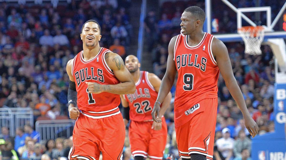 Bulls guard Derrick Rose reacts with Luol Deng