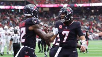 Houston Texans wide receiver Nico Collins (12) and quarterback C.J. Stroud (7) celebrate a touchdown during the fourth quarter against the Arizona Cardinals at NRG Stadium.