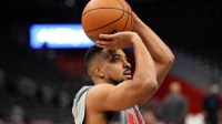 Washington Wizards guard CJ McCollum (3) takes a shot before a game against the Orlando Magic at Capital One Arena.
