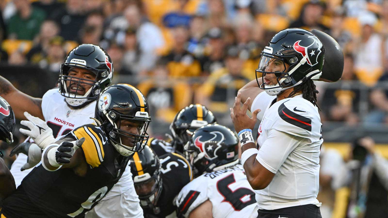 Houston Texans quarterback C.J. Stroud (7) throws a pass while being pressured by Pittsburgh Steelers defensive tackle Keeanu Benton during the first quarter at Acrisure Stadium. 