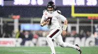 Houston Texans quarterback C.J. Stroud (7) runs with the ball in the third quarter against the New England Patriots in an AFC Divisional Round game at Gillette Stadium.