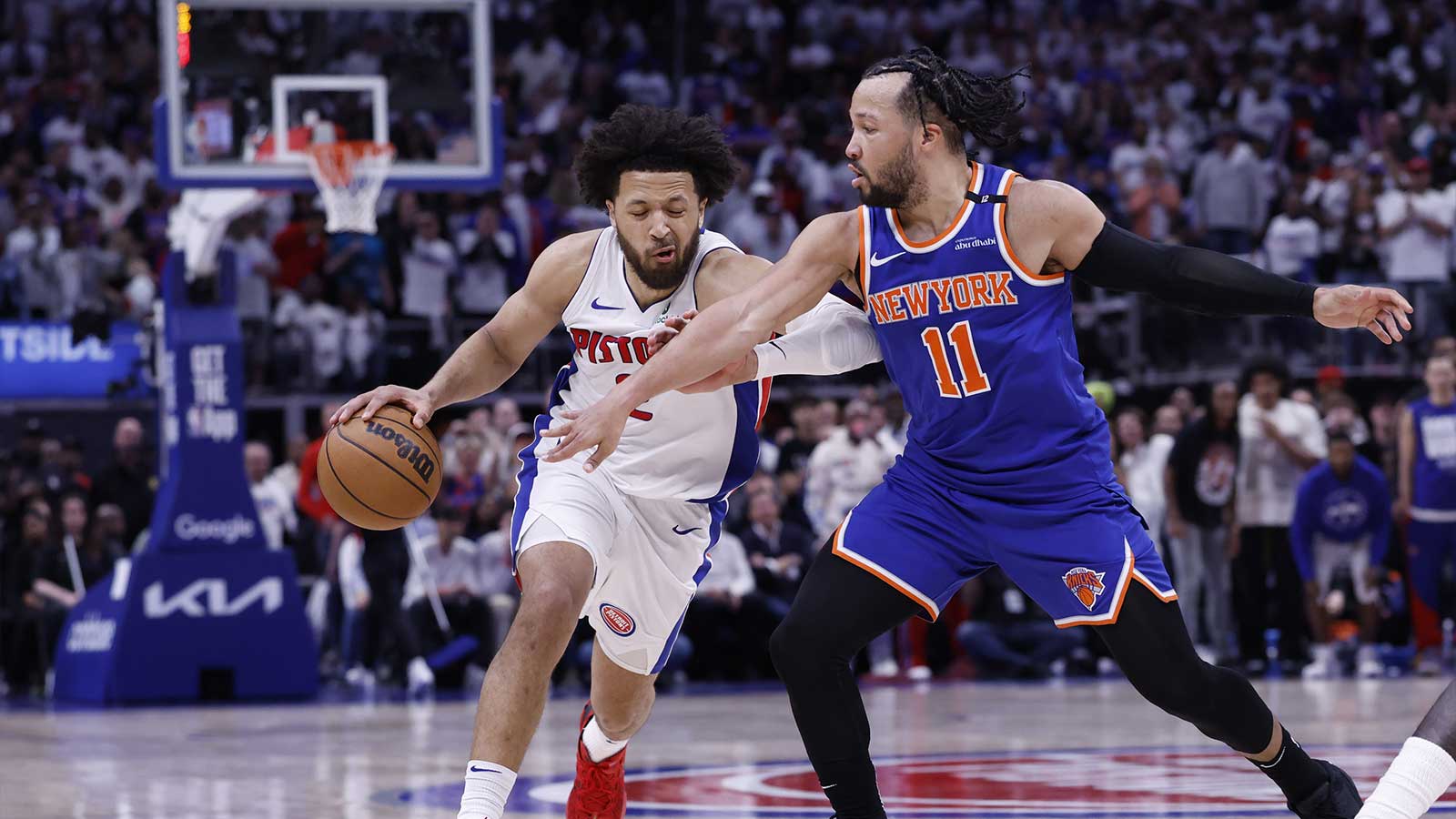 Detroit Pistons guard Cade Cunningham (2) dribbles defended by New York Knicks guard Jalen Brunson (11) in the second half during game six of first round for the 2024 NBA Playoffs at Little Caesars Arena.