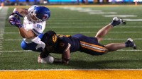 Southern Methodist Mustangs tight end Matthew Hibner (88) scores a touchdown against California Golden Bears linebacker Cade Uluave (0) during the third quarter at California Memorial Stadium.