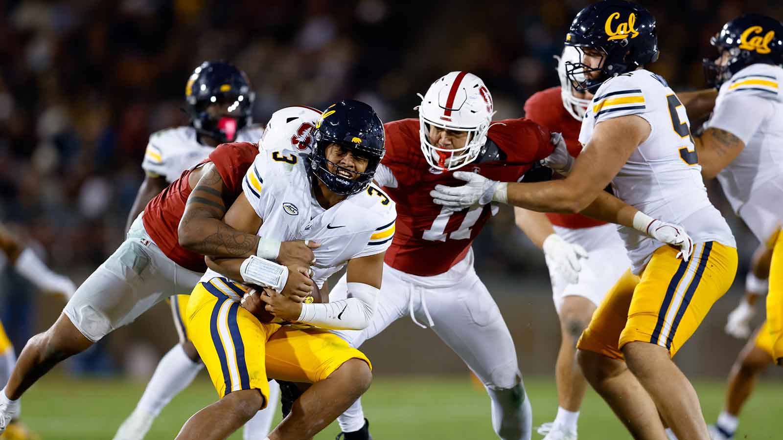 California Golden Bears quarterback Jaron-Keawe Sagapolutele (3) is sacked by Stanford Cardinal linebacker Ernest Cooper (44) during the fourth quarter at Stanford Stadium.