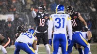 Chicago Bears quarterback Caleb Williams (18) calls the snap count at the line of scrimmage against the Los Angeles Rams during the first quarter of an NFC Divisional Round game at Soldier Field. Mandatory Credit: Matt Marton-Imagn Images