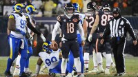 Chicago Bears quarterback Caleb Williams (18) looks on against the Los Angeles Rams during overtime of an NFC Divisional Round game at Soldier Field