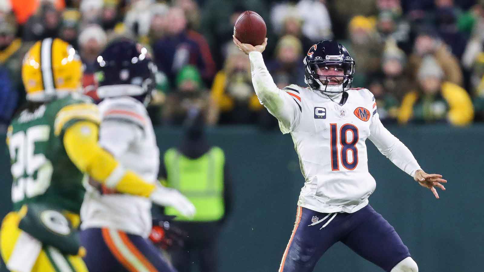 Chicago Bears quarterback Caleb Williams (18) passes the ball against the Green Bay Packers in the first half at Lambeau Field.