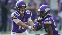 Minnesota Vikings quarterback Max Brosmer (12) hands off to running back Cam Akers (31) in the fourth quarter of the NFL Week 3 game between the Minnesota Vikings and the Cincinnati Bengals at U.S. Bank Stadium in Minneapolis on Sunday, Sept. 21, 2025. The Vikings won, 48-10.