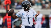 Tennessee Titans quarterback Cam Ward (1) throws a pass against the Jacksonville Jaguars during the first quarter at EverBank Stadium