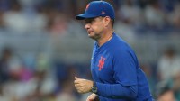 New York Mets manager Carlos Mendoza (64) returns to the dugout after a pitching change against the Miami Marlins during the fourth inning at loanDepot Park.