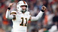 Miami Hurricanes quarterback Carson Beck (11) reacts in the first half during the 2026 Fiesta Bowl and semifinal game of the College Football Playoff at State Farm Stadium.