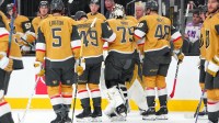 Vegas Golden Knights goaltender Carter Hart (79) is helped off the ice by left wing Ivan Barbashev (49) and center Tomas Hertl (48) after sustaining an injury against the Columbus Blue Jackets during the first period at T-Mobile Arena.