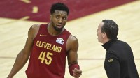 Cleveland Cavaliers guard Donovan Mitchell (45) talks to head coach Kenny Atkinson in the fourth quarter against the Houston Rockets at Rocket Mortgage FieldHouse.