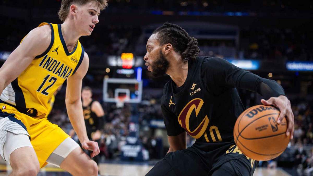 Cleveland Cavaliers guard Darius Garland (10) dribbles the ball while Indiana Pacers guard Johnny Furphy (12) defends in the first half at Gainbridge Fieldhouse.
