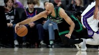 Boston Celtics guard Derrick White (9) dives for a loose ball against the Sacramento Kings during the second quarter at Golden 1 Center.