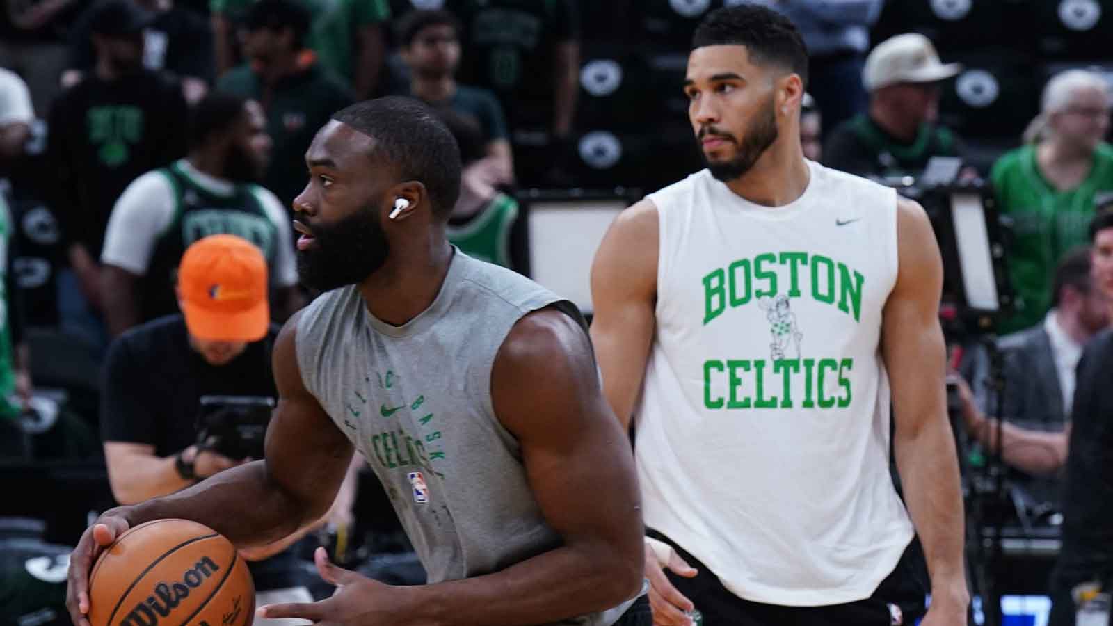 Celtics guard Jaylen Brown (7) and forward Jayson Tatum (0) warm up before game five of first round for the 2025 NBA Playoffs against the Orlando Magic at TD Garden