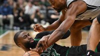 Boston Celtics guard Jaylen Brown (7) and San Antonio Spurs forward Harrison Barnes (40) battle for the ball during the second half at the TD Garden.