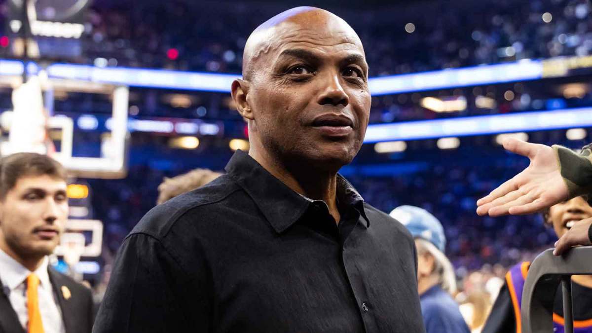 Charles Barkley in attendance against the Minnesota Timberwolves during an NBA Cup game at Mortgage Matchup Center with the Thunder and Nuggets logos in the background