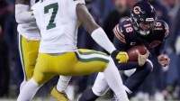Chicago Bears quarterback Caleb Williams (18) runs for a first down during overtime in their game Saturday, December 20, 2025 at Soldier Field in Chicago, Illinois. The Chicago Bears beat the Green Bay Packers 22-16 in overtime.