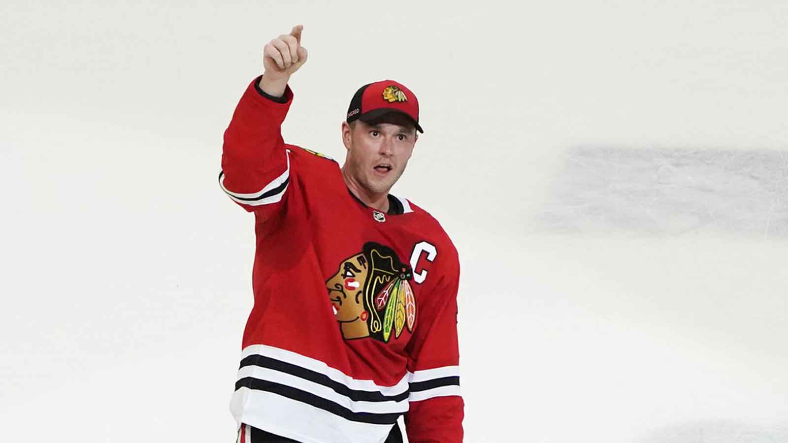 Blackhawks’ Connor Murphy glows over Jonathan Toews before Chicago return