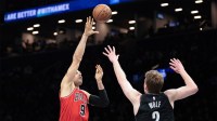 Jan 16, 2026; Brooklyn, New York, USA; Chicago Bulls center Nikola Vucevic (9) shoots the ball against Brooklyn Nets forward Danny Wolf (2) during the second half at Barclays Center. Mandatory Credit: Vincent Carchietta-Imagn Images