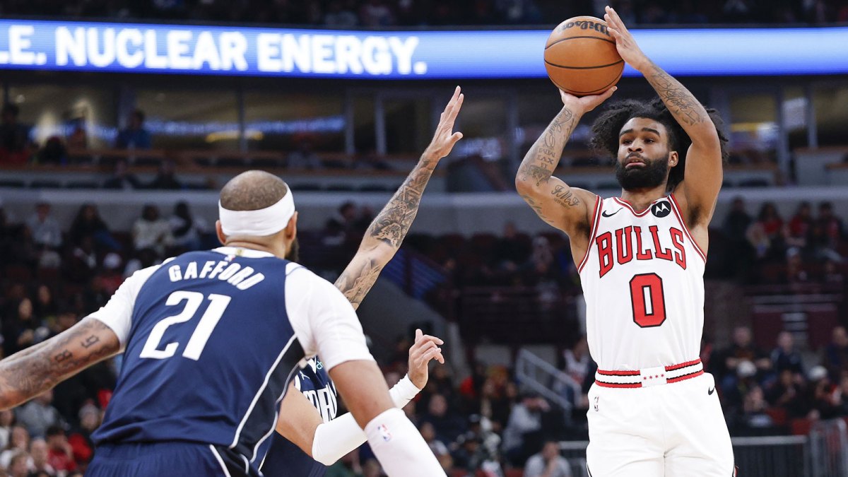 Jan 10, 2026; Chicago, Illinois, USA; Chicago Bulls guard Coby White (0) shoots against the Dallas Mavericks during the first half at United Center. Mandatory Credit: Kamil Krzaczynski-Imagn Images