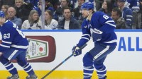 Toronto Maple Leafs defenseman Chris Tanev (8) passes the puck against the Ottawa Senators during the second period at Scotiabank Arena.