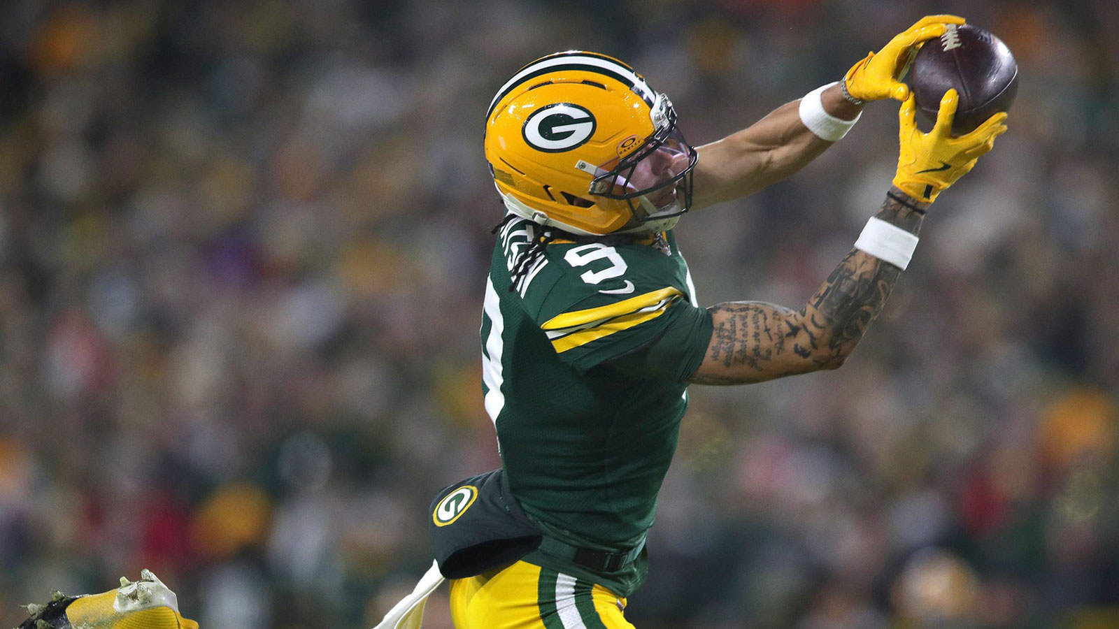 Green Bay Packers wide receiver Christian Watson (9) catches a touchdown pass against the Baltimore Ravens on Saturday, December 27, 2025, at Lambeau Field in Green Bay, Wis.