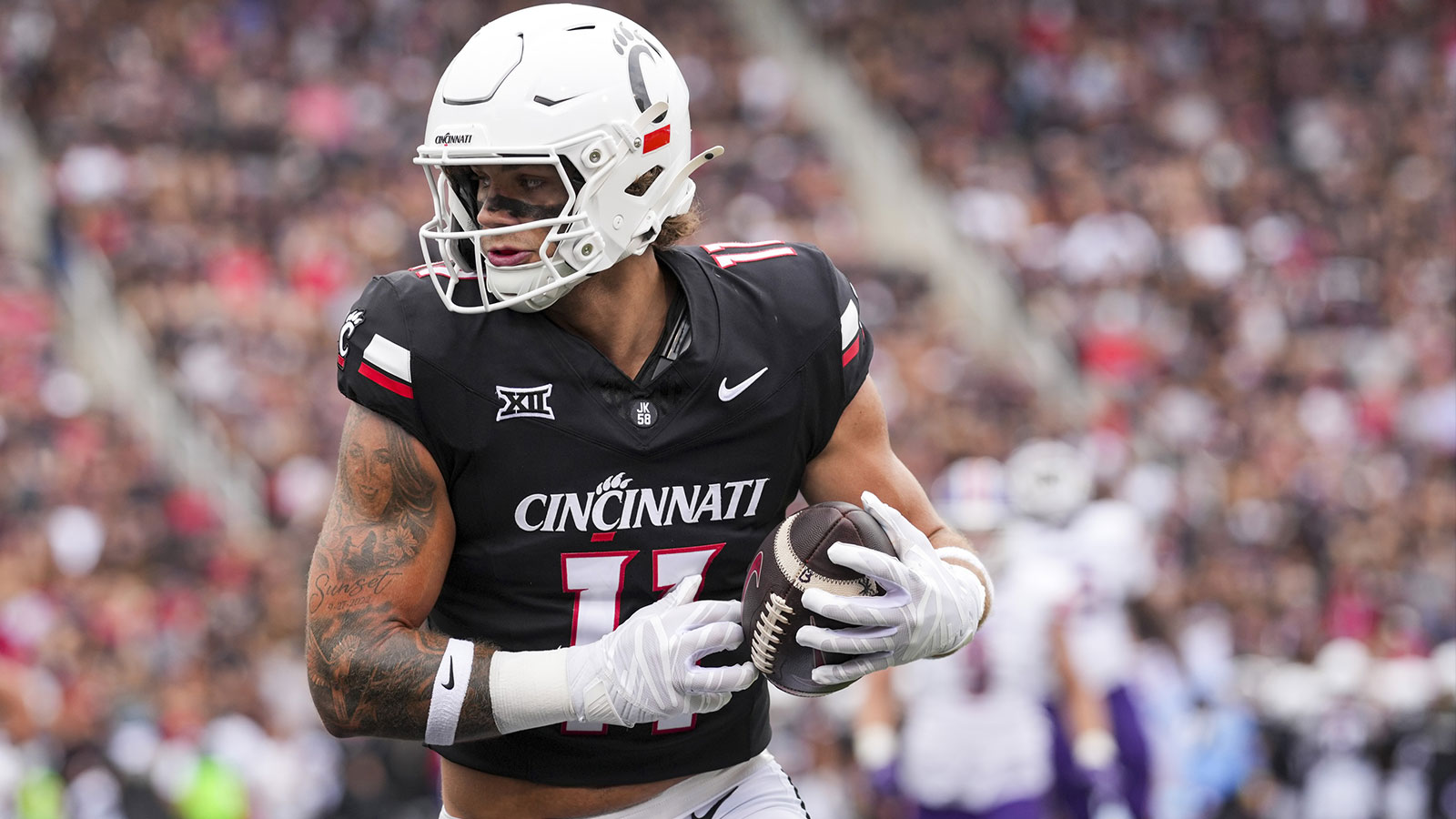 Cincinnati Bearcats tight end Joe Royer (11) catches a pass for a touchdown against the Northwestern State Demons in the first half at Nippert Stadium.