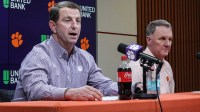 Clemson Head Coach Dabo Swinney, left, introduces Chad Morris as football Offensive Coordinator for during a press conference in the Smart Family Media Center in Clemson, SC.