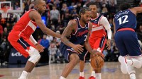 Los Angeles Clippers forward Kawhi Leonard (2) steals the ball from Washington Wizards forward Khris Middleton (22) in the second half at Intuit Dome.