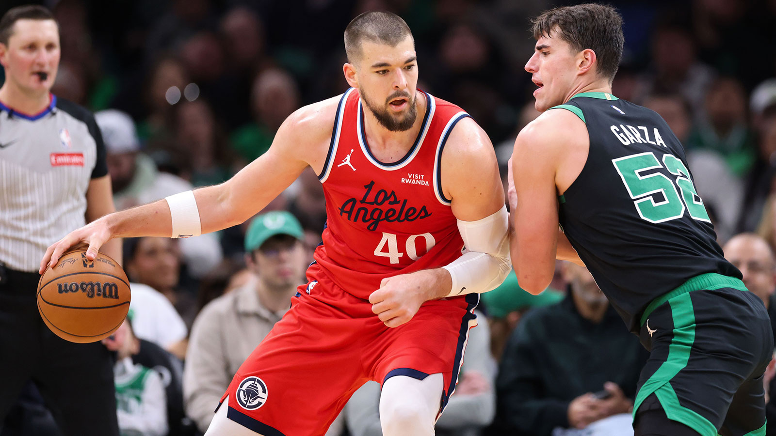 Celtics forward Luka Garza (52) defends Los Angeles Clippers center Ivica Zubac (40) during the first half at TD Garden