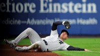 New York Yankees left fielder Cody Bellinger (35) slides to makes a catch during the first inning against the Toronto Blue Jays during game four of the ALDS round for the 2025 MLB playoffs at Yankee Stadium