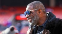 Legendary football and baseball player and father of Cleveland Browns quarterback Shedeur Sanders, Deion Sanders on the sidelines prior to a game against the Buffalo Bills at Huntington Bank Field.