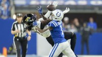 Indianapolis Colts cornerback Sauce Gardner (1) breaks up a pass intended for Jacksonville Jaguars wide receiver Brian Thomas Jr. (7) during a game at Lucas Oil Stadium.