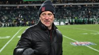 Washington Commanders owner Josh Harris on the sidelines against the Philadelphia Eagles at Lincoln Financial Field.