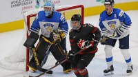 Team Canada forward Connor Bedard (16) looks for a pass in font of Team Finland goaltender Juha Jatkola (31) during the second period in the championship game during the IIHF U20 Ice Hockey World Championship at Rogers Place.