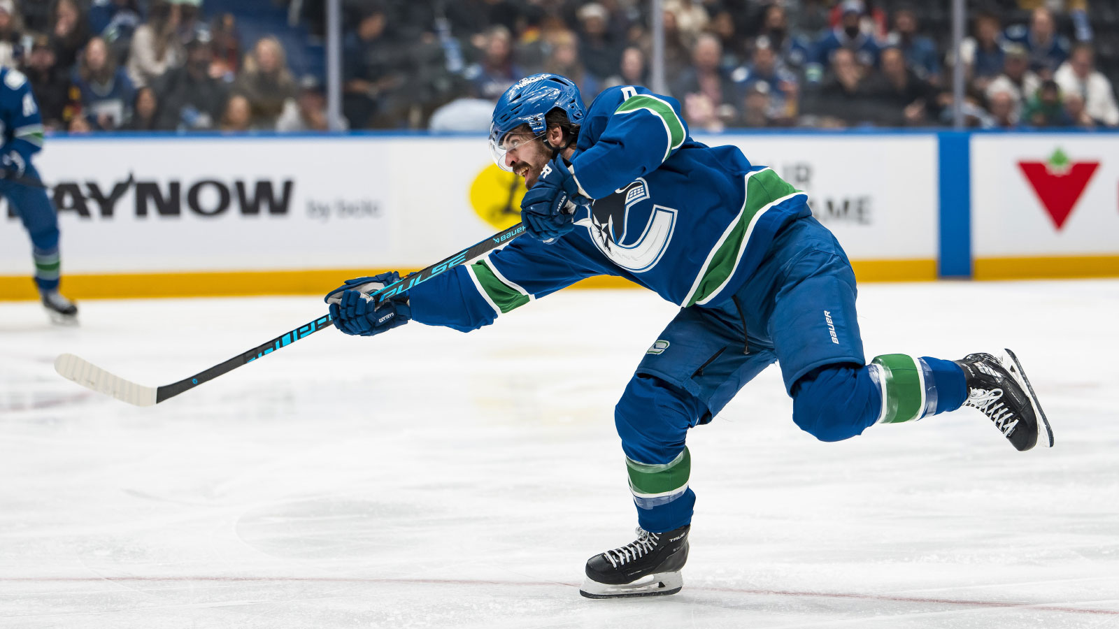 Vancouver Canucks forward Conor Garland (8) shoots against the Pittsburgh Penguins in the second period at Rogers Arena.