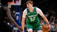 Dallas Mavericks forward Cooper Flagg (32) looks to move the ball against the Brooklyn Nets during the second quarter at the American Airlines Center