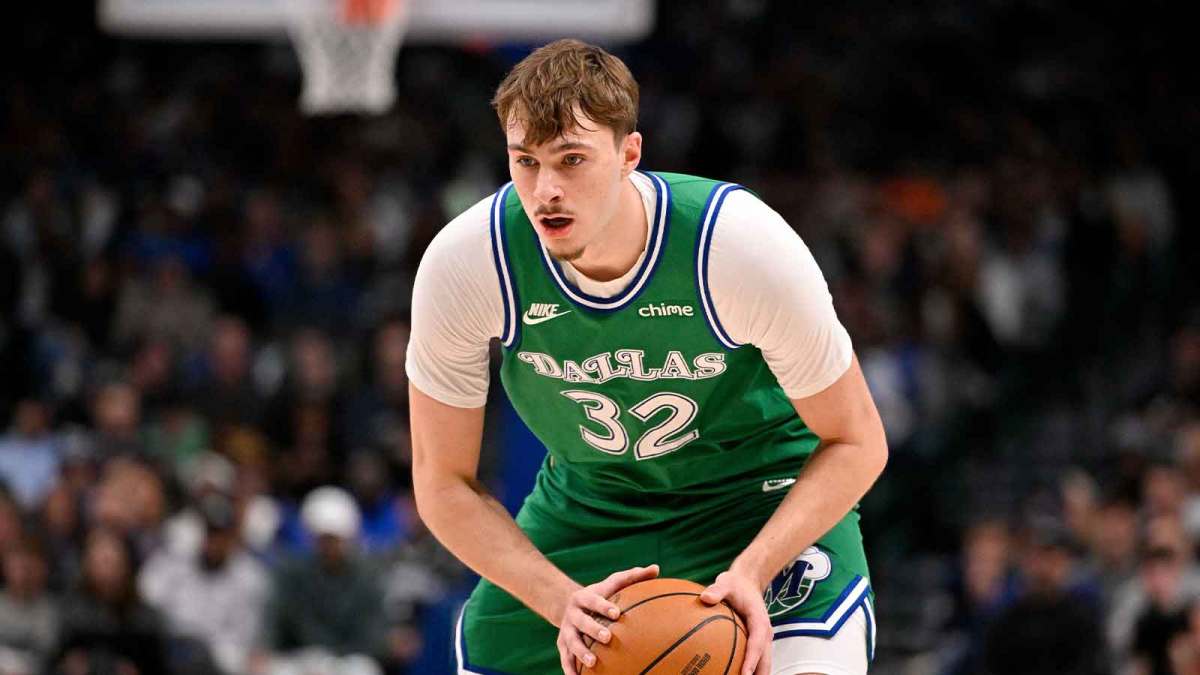 Dallas Mavericks forward Cooper Flagg (32) looks to move the ball against the Brooklyn Nets during the second quarter at the American Airlines Center.