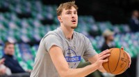 Dallas Mavericks forward Cooper Flagg (32) warms up before the game against the Charlotte Hornets at American Airlines Center.